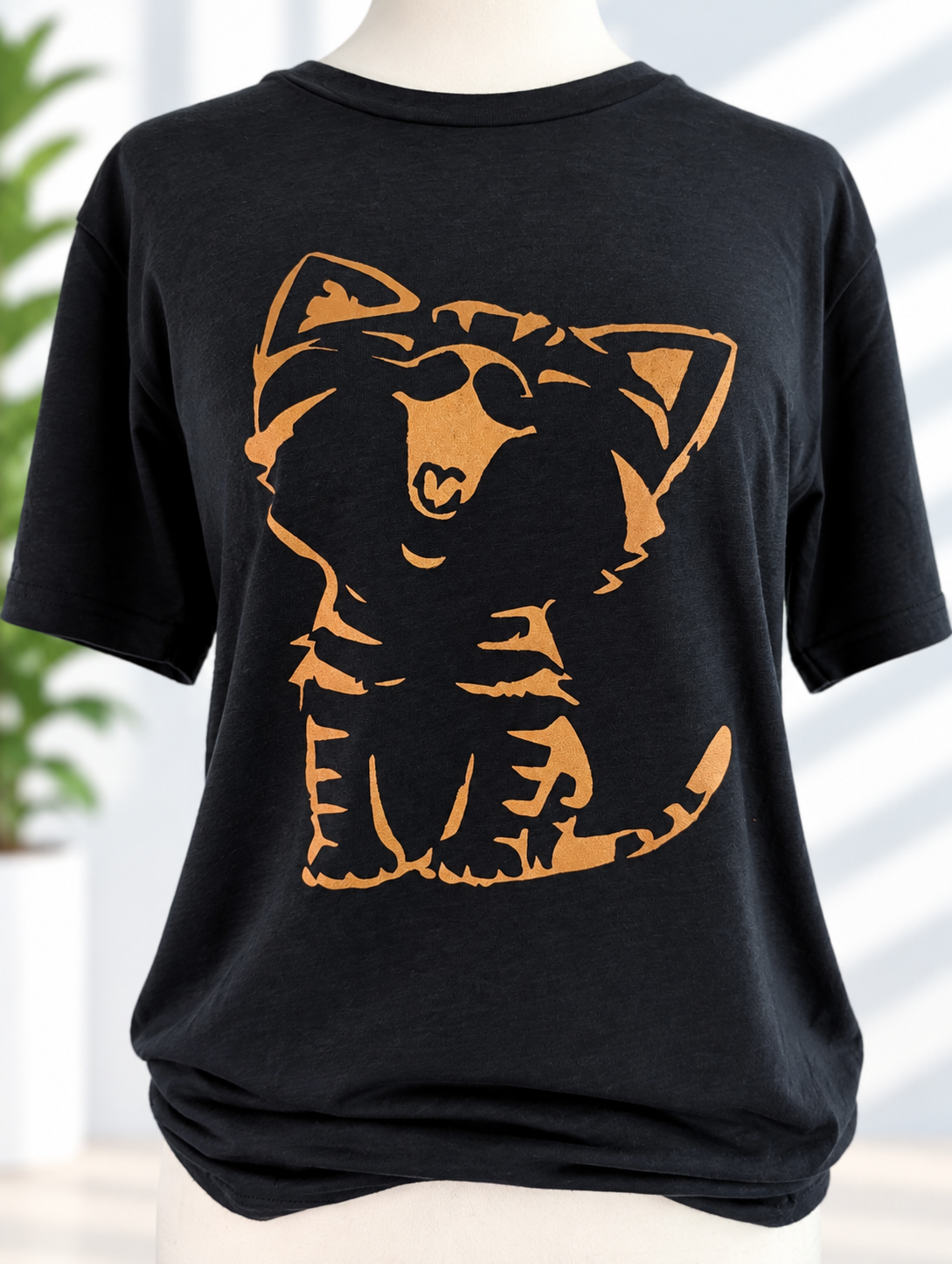 Black t-shirt with hand-painted orange cat stencil design