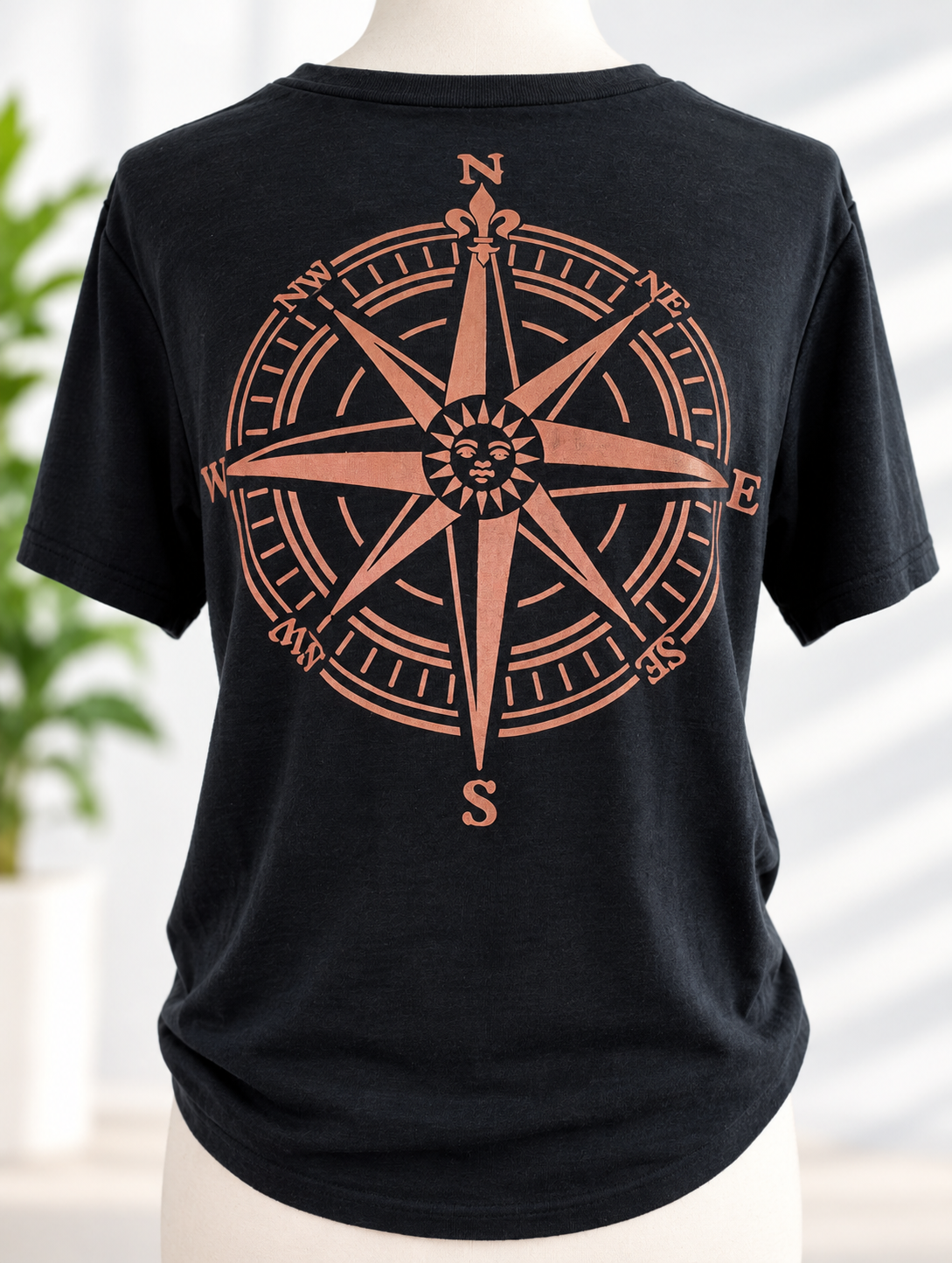 Black t-shirt with hand-painted compass rose design on the back
