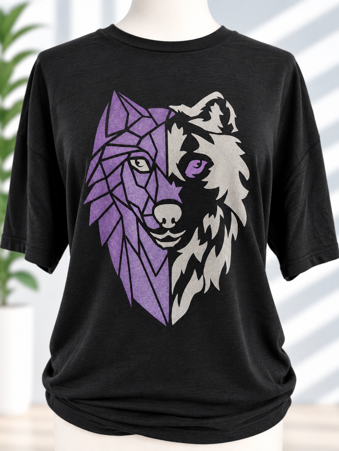 Black t-shirt with hand-painted split wolf design — geometric purple on one side, cream fur on the other