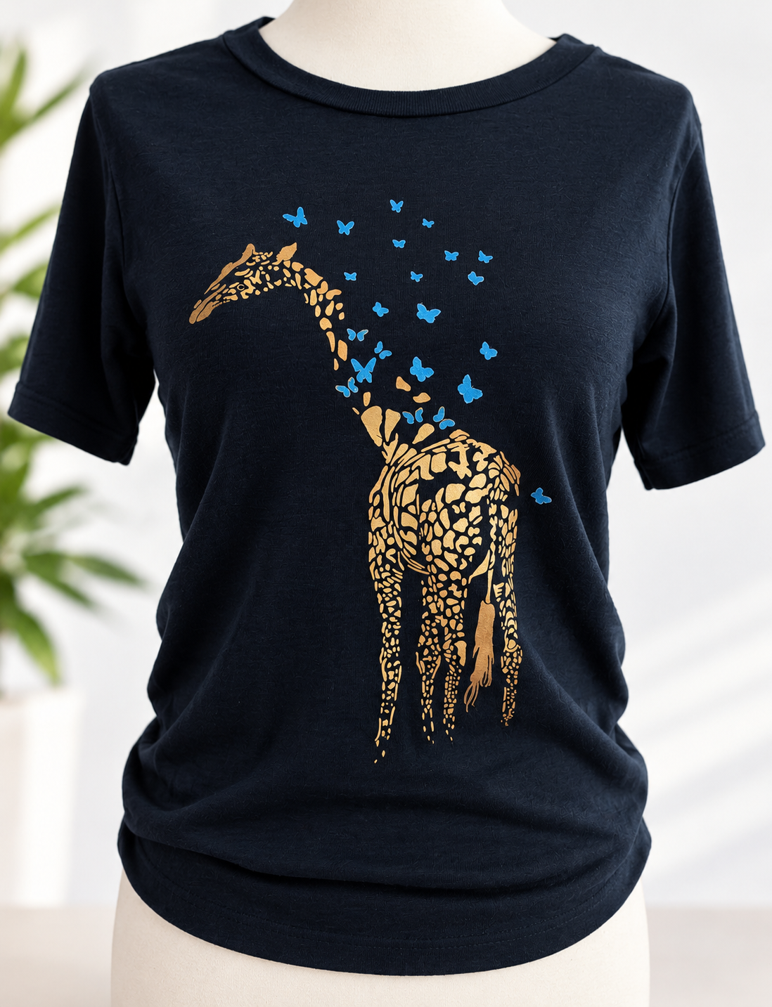 T-shirt with giraffe transforming into blue butterflies design