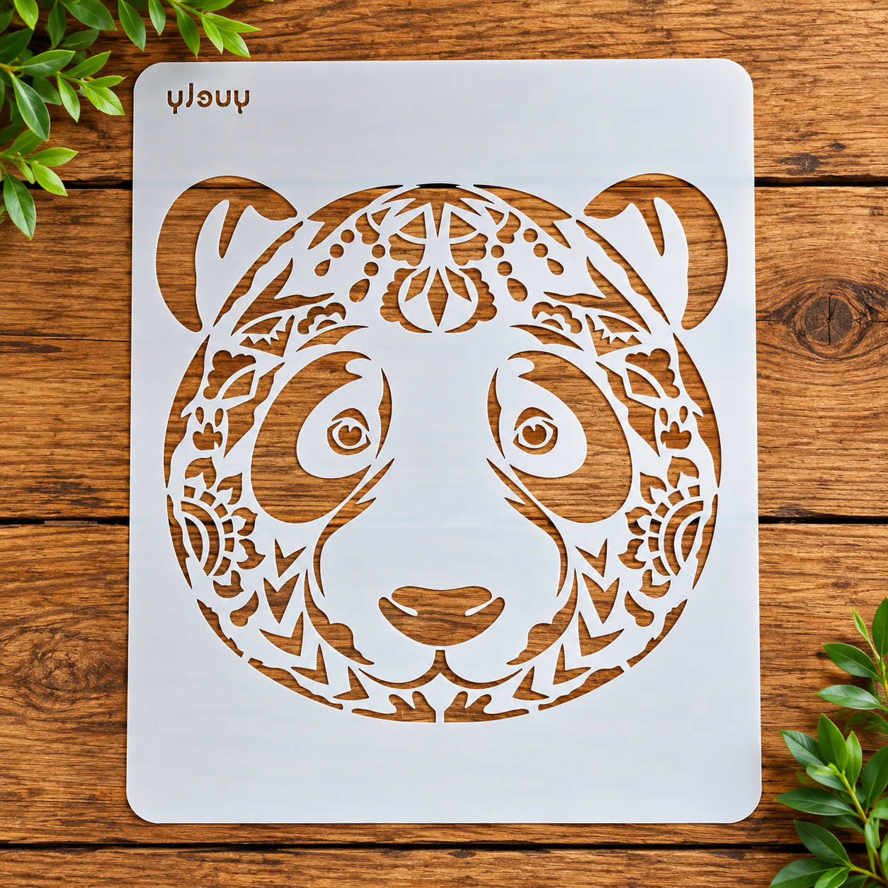 Ornate panda stencil on wood